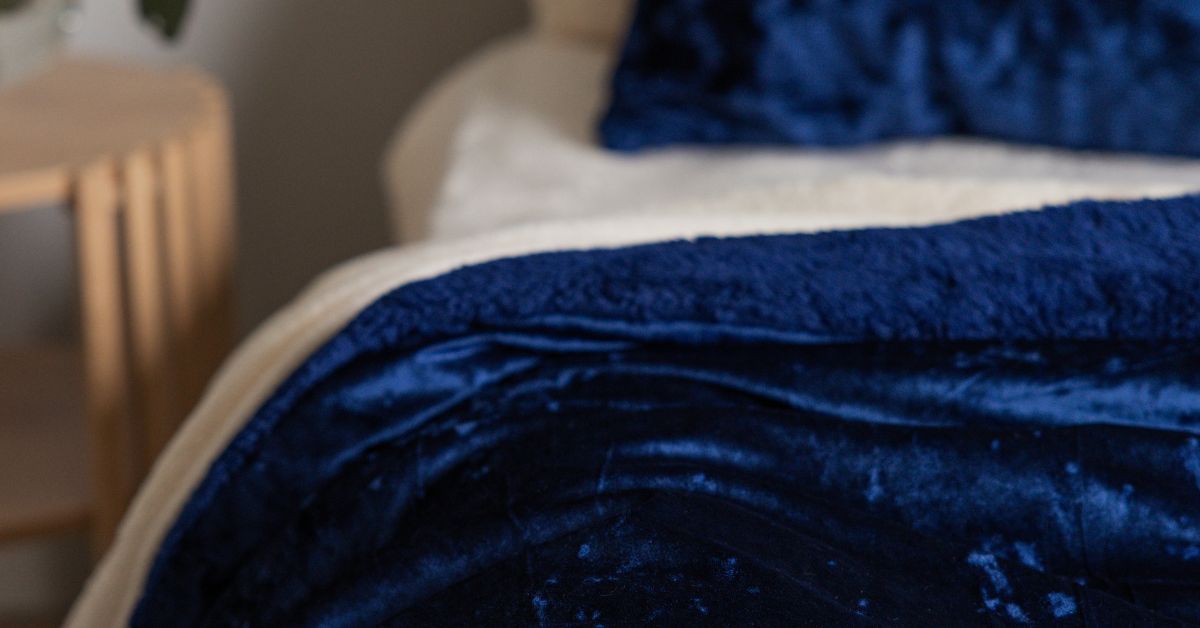 close up of navy blue crushed comforter